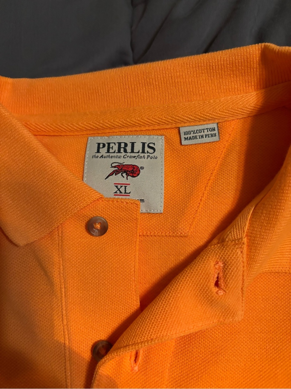 Boys Orange Polo with Contrast Chest Emblem of crawfish